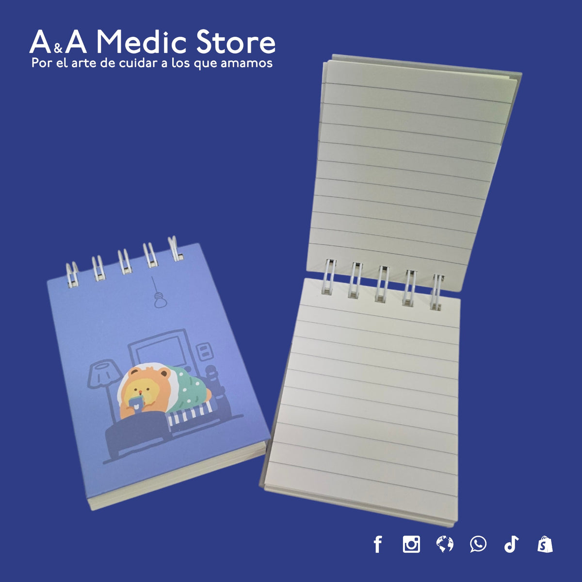 A&A Medic Store mini flip-top medical notebook with a cute lion illustration on the cover and lined pages inside.
